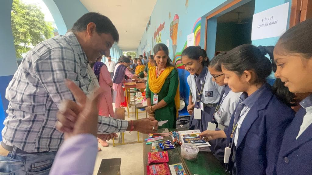 Fun Fair Stalls. Students host the corridor with a smile