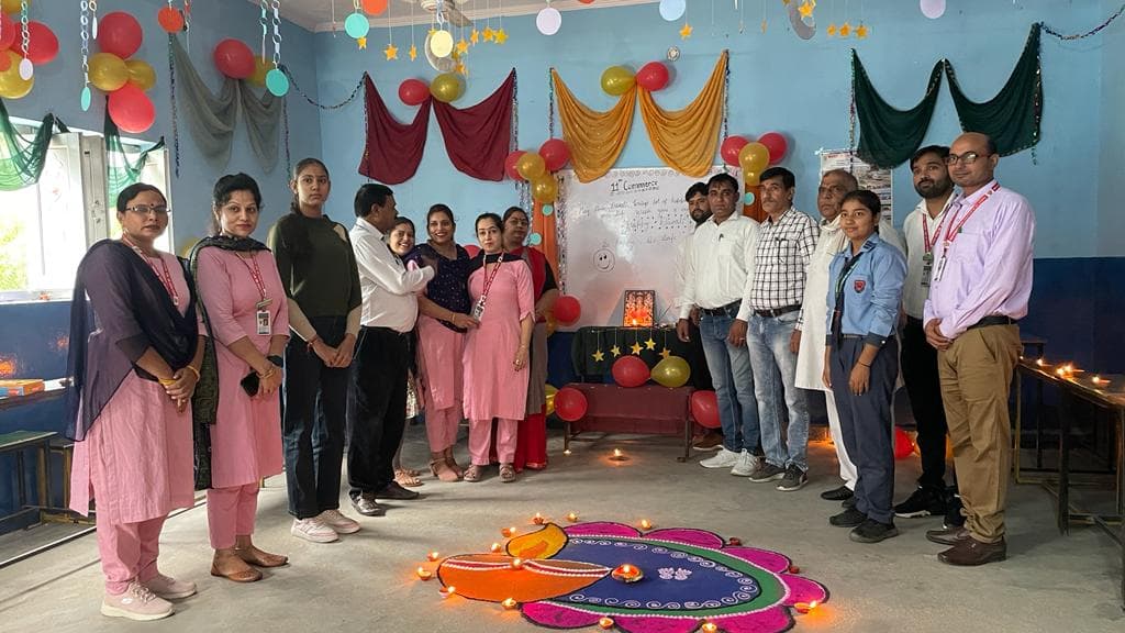 Celebration Evening. Lamps, balloons, and a shared rangoli